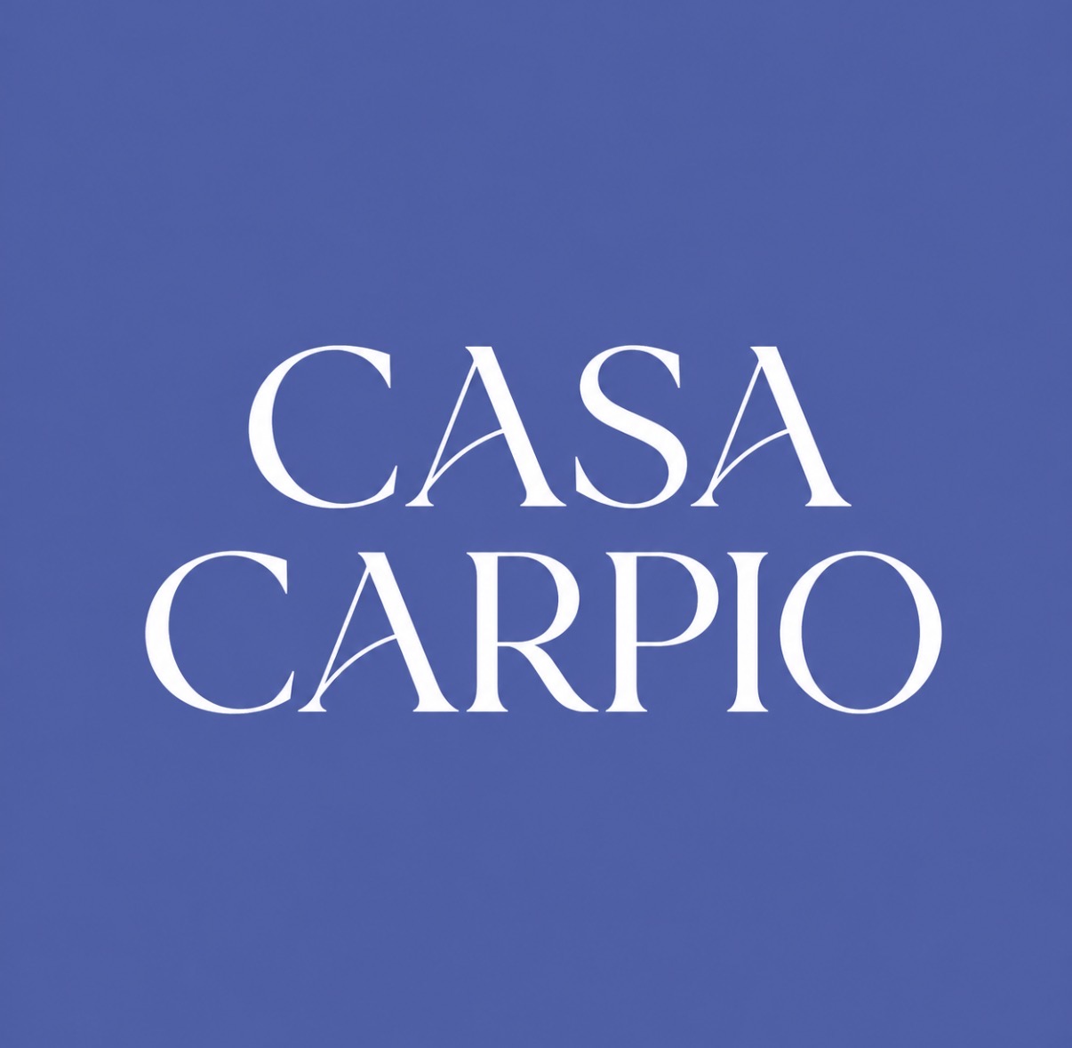Casa Carpio wordmark in cream on cobalt blue