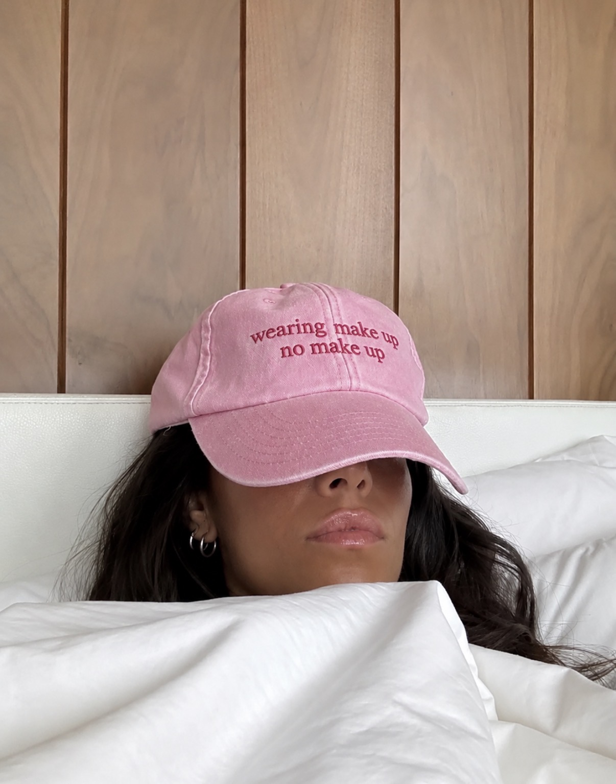 Antiq embroidered cap reading wearing make up no make up